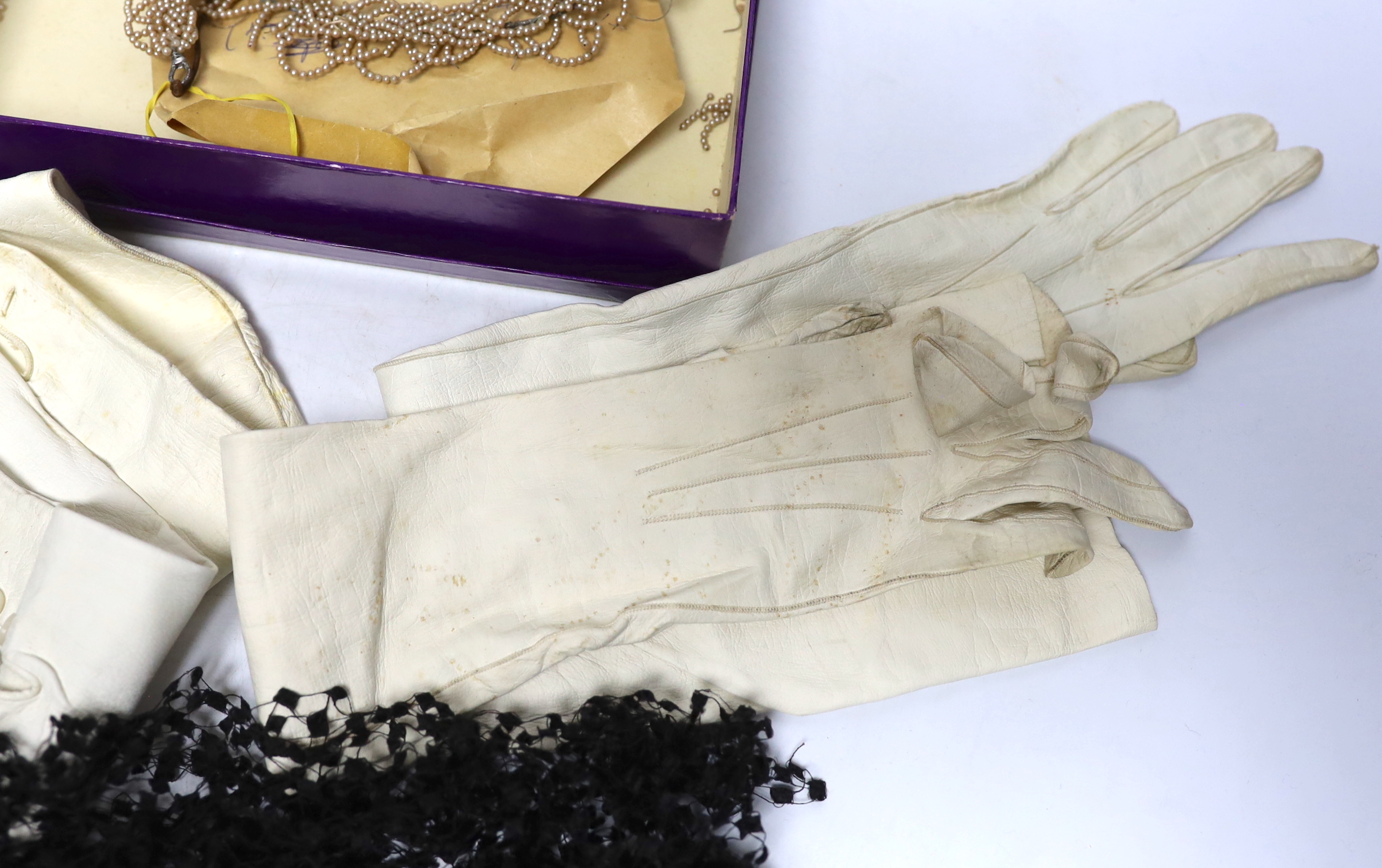 Cream leather evening gloves, bonnet veiling and decorative bridal headdress